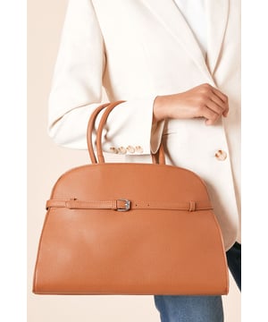 Structured bowler silhouette with elegant curved top handles
        Decorative buckle detail across the front for a polished finish
        Detachable and adjustable crossbody strap for versatile carrying options
        Spacious interior with ample room for daily essentials
        Secure top closure to keep belongings safe and protected
    
    The York Large Bowler Bag combines practicality with sophisticated style for your everyday adventures. The classic structured shape offers generous capacity for all your necessities, whilst the decorative buckle detail adds a touch of refinement to this versatile piece. Carry it by the sturdy top handles for a chic daytime look, or attach the crossbody strap when you need hands-free convenience whilst shopping or meeting friends for coffee. This Dorothy Perkins bag pairs beautifully with casual denim and trainers for weekend brunches, or team it with a relaxed blazer and ballet flats for family gatherings. The neutral design makes it an ideal companion for your daywear wardrobe, effortlessly complementing both casual and smart-casual outfits without overwhelming your look.