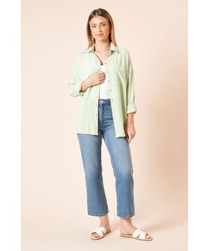 Lightweight cheesecloth fabric with delicate textured finish
        Relaxed oversized fit with dropped shoulders for effortless style
        Classic collar and full button-through front design
        Convenient chest pocket detail for added functionality
        Long sleeves with turn-up cuff option for versatile wearing
    
    This breezy cheesecloth shirt from Dorothy Perkins offers the perfect balance of comfort and style for your casual wardrobe. The relaxed silhouette creates a flattering, laid-back look that pairs beautifully with denim, as shown by our model who styles it with straight-leg jeans and simple white sandals. Wear it buttoned up with tailored trousers for lunch with friends, or open as a light layer over a basic vest for family gatherings. The versatile design makes it ideal for weekend brunches or baby showers when you want to look put-together without appearing overdressed. For cooler days, simply roll down the sleeves and layer under a cardigan or casual jacket. Machine washable and crafted from viscose, this shirt delivers on both practicality and style for the modern woman who values comfort without compromising on trend-conscious details.
