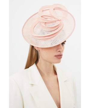 Get dressed up and finish the look with a fascinator, with an easy to wear small size and spiral detailing, fitted onto a comfortable headband. Styles perfectly with a dress or pantsuit in matching tones for a look ideal for wedding guest days and days at the racecourse. Asymmetric Disc Headband Fascinator Unique, Swirling Design Sheer, Circular Disc Base Easy to Wear, Smaller Size Comfortable HeadbandBrowse this seasons women's fascinators or discover the full range of women's accessories now.