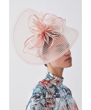 Get dressed up and finish the look with a fascinator, with a statement, large size and feather detailing, fitted onto a comfortable headband. Styles perfectly with a dress or pantsuit in matching tones for a look ideal for wedding guest days and days at the racecourse. Feather Detail Fascinator Unique Feather Detailing Sheer, Circular Disc Base Statement Large Size Easy to Wear HeadbandBrowse this seasons women's fascinators or discover the full range of women's accessories now.