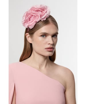 Make a captivating statement with this Karen Millen Detailed Headband Fascinator. The crafted rose embellishments create a sophisticated focal point that commands attention at any special occasion. Style with sleek, straight hair for maximum impact, or pair with an elegant updo to showcase the fascinator's intricate detailing. Perfect for race days, summer weddings or formal garden parties, this headpiece transforms even the simplest dress into a refined ensemble. The versatile design works brilliantly with both asymmetric necklines and classic silhouettes, offering endless styling possibilities for your most memorable occasions.  Striking floral design featuring two oversized rose embellishments Comfortable headband structure for secure all-day wear Delicate layered petal detailing Elegant fascinator height adds dramatic flair to any ensemble