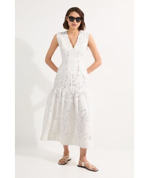 This Karen Millen woven maxi dress showcases exquisite broderie anglaise detailing that adds texture and dimension to your daytime ensemble. The tiered design creates a relaxed yet refined silhouette. Style with flat leather sandals and oversized sunglasses for a sophisticated garden party look or pair with a denim jacket and trainers for casual weekend brunches. The cotton elements ensure breathability, while the maxi length offers coverage with a contemporary edge. Accessorise with delicate gold jewellery and a woven tote to complete this effortlessly stylish daywear option that transitions seamlessly from city strolls to countryside escapes.   Intricate cutwork broderie detailing throughout Elegant V-neckline frames the dcolletage  Tiered maxi silhouette Sleeveless design Practical side pockets