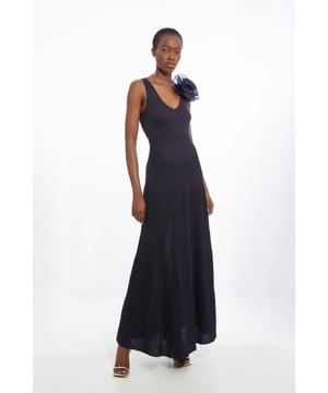 Elevate your formal wardrobe in our occasion dress, with a bodycon fitting bodice which flows into a flared skirt, a plunging V neckline which accentuates the bust, and a statement three dimensional corsage design. Style it with strappy heels for an occasion look that is guaranteed to turn heads wherever you step. Viscose Blend Knit Corsage Detail Maxi Dress High Quality, Soft Knit Fabric Statement Three Dimensional Rosette Detailing Figure Hugging Bodice Flared, Flowing Skirt Plunging V Neckline