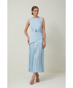 This Karen Millen Ponte and Georgette Jersey Pleated Maxi Dress combines structure and fluidity for an effortlessly stylish look. The fitted bodice creates a flattering silhouette while the pleated georgette skirt adds dramatic movement with every step. Style with strappy heels and statement earrings for sophisticated daytime events, or pair with a cropped denim jacket and trainers for a more casual approach. The belted waist detail creates definition and can be adjusted to suit your preference. Perfect for family gatherings, brunches or gallery visits, this dress transitions from day to evening with a simple change of accessories.  Sleek crew neckline with sleeveless design Striking contrast between ponte jersey bodice and flowing georgette pleated skirt Belted waist with rectangular buckle detail Maxi length with pleated skirt