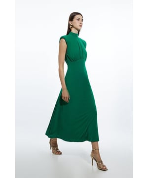 Embrace standout sophistication with this corset detail maxi dress. Crafted from a flattering jersey crepe material, this drapey maxi dress is cut with a statement high neckline, power shoulders and finished with a corset-inspired waistline. Simply pair with barely there heels for effortless evening attire. Drapey Crepe Jersey Corset Detail Maxi Dress Soft Jersey Crepe Fabric Statement High Neckline Flattering Sleeveless Finish Power Shoulders Corset Detail Flattering Maxi LengthDiscover this seasons corset dresses or browse the full collection of women's dresses now.