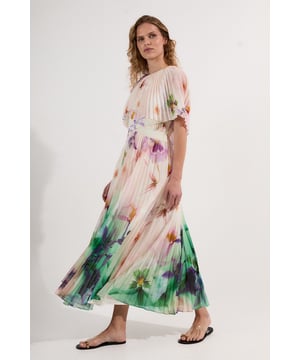 Make a statement at your next special occasion with this breathtaking Karen Millen maxi dress. The exquisite pleated design features ethereal cape sleeves that create a graceful, floating effect as you move, while the high neckline provides elegant coverage that contrasts with the alluring low back detail. The artistic floral pattern cascades down the dress, intensifying towards the hemline for a truly eye-catching effect. Pair with strappy heeled sandals for formal events such as summer weddings or garden parties, or dress down with flat leather sandals for sophisticated daytime gatherings. This versatile piece transitions effortlessly from day to evening with just a change of accessories.  Elegant high neck design with dramatic cape sleeves Striking pleated texture Alluring low back detail Flowing maxi length Captivating floral pattern with a watercolour-inspired gradient effect