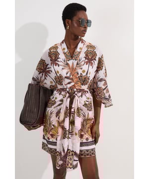 This Karen Millen mini dress showcases a captivating abstract print that brings a touch of artistic flair to your daywear collection. The kimono sleeves create a relaxed yet sophisticated silhouette, while the V-neckline adds a feminine touch. The cotton fabric ensures all-day comfort, making it perfect for family gatherings or garden parties. Pair with flat sandals and delicate gold jewellery for a laid-back daytime look, or dress up with espadrille wedges for alfresco dining. The waist-tie detail allows you to customise the fit to your preference, creating a silhouette that's both flattering and comfortable for various body types.   Striking abstract print mini dress with eye-catching tropical motifs Elegant kimono sleeves Flattering V-neckline  Waist-defining belt detail Crafted from pure cotton for breathable comfort in warm weather