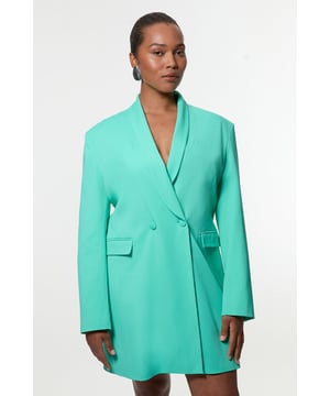 Command attention in the boardroom with this impeccably tailored blazer dress. The double-breasted design creates a structured silhouette that conveys confidence and authority, whilst the cinched detail at the back offers a flattering shape that accentuates your waistline. Perfect for the professional woman who refuses to compromise on style, this versatile piece transitions seamlessly from important meetings to after-work gatherings. Complete the look with pointed court shoes for classic sophistication, or add opaque tights and ankle boots during cooler months.  Sophisticated double-breasted design with button fastening Tailored collar with lapels Cinched detail at the back with adjustable belt Functional front pockets Mini length cut