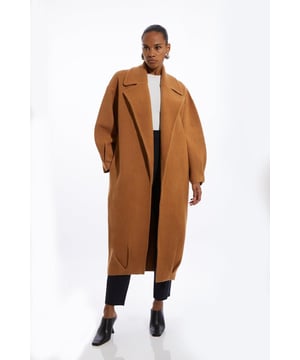 The perfect choice for transitioning seasons , this soft knit coat features a soft, thick knitted fabric, and is designed with an ultra comfortable, relaxed fit, and a collared neckline to elevate the formality. Style it with anything, from jeans to tailored separates for looks that will take you from office days to coffee catch ups. Compact Wool Blend Oversized Knit Coat High Quality Knit Wool Blend Fabric Relaxed, Open Design Comfortable, Relaxed Fit Classic Collar Feature Long, Midaxi LengthShop this seasons wool coats or browse the full collection of coats and jackets now.