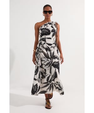 This captivating Karen Millen midi dress showcases a bold palm print that commands attention whilst maintaining effortless sophistication. The asymmetric one-shoulder neckline creates a flattering silhouette that draws the eye, whilst the lightweight cotton voile fabric ensures you stay cool and comfortable during sun-soaked days. Style with oversized sunglasses for a refined beach-to-bar look - perfect for sunset cocktails by the sea or leisurely strolls along the promenade. For daytime beachwear, pair with flat leather sandals and a woven tote, or dress up with strappy heels and statement jewellery for evening soire on your summer holiday. The versatile midi length works beautifully for various occasions, making this a must-have addition to your warm-weather wardrobe.   Striking one-shoulder design with elegant palm print Crafted from breathable cotton voile fabric Flowing midi length silhouette Subtle shoulder tie detail adding a touch of feminine charm