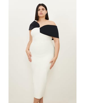 Experience opulence in our plus size midi dress, with a fitted silhouette, and an asymmetric strap design, with one that sits off the shoulder and one on the shoulder. Style it with strappy heels for an occasion look that will take you from wedding guest days to party nights. Plus Size Figure Form Bandage Knit Asymmetric Strap Midi Dress High Quality, Soft Knit Fabric Flattering Figure Hugging Fit Unique, Asymmetric Strap Detailing Thigh High Leg Split in Back Zip Fastening in Back Expertly designed for those UK size 18/US size 14 and above, our plus size clothing collection is perfectly proportioned to ensure you look stylish at every shape. Discover our collection of plus size midi dresses or browse our range of plus size clothing now.