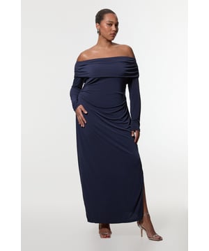 Make a striking entrance at your next formal event with this captivating Karen Millen Plus Size Bardot Drapey Midi Dress. The alluring off-shoulder neckline showcases your decolletage whilst the ruched detailing accentuates your curves beautifully. Perfect for weddings, races, or graduations, this dress combines elegance with comfort. Style it with strappy heels and statement earrings for a polished look. For cooler evenings, drape a shawl over your shoulders. The versatile design allows for both daytime sophistication and evening glamour, making it a wardrobe staple for various occasions. Embrace your feminine silhouette and radiate confidence in this stunning midi dress that's sure to turn heads.  Elegant Bardot neckline with drapey off-shoulder design Figure-flattering ruched detailing on the side Long sleeves for a sophisticated touch Midi length with a subtle side slit for ease of movement Versatile jersey fabric offers comfort and style
