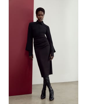 Presenting The Founder: Elevated collection, in collaboration with Karen Millen OBE. Enjoy Karen Millen legacy designs, with timeless silhouettes and classic details that are forever on-trend and ready to wear.  Add a little formality in our plus size blouse. The textured design and long sleeves give a formal feel to the piece, and the relaxed silhouette makes for a comfortable blouse that can be worn from day to night. This piece pairs well with anything, from a flowing midi skirt, to tailored trousers, to jeans for an elevated daytime look. The Founder Plus Size Satin Pintuck Woven Blouse High Quality, Smooth Satin Fabric Statement Pintucked Design High, Round Neckline Floaty, Relaxed Fit Button Front Fastenings Expertly designed for those UK size 18/US size 14 and above, our plus size clothing collection is perfectly proportioned to ensure you look stylish at every shape.Discover this seasons party dresses or browse the full colleciton of women's dresses now.