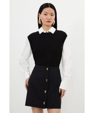 Taking inspiration from preppy style, this mini skirt features a straight design and high waist with a playful mini length. Finished with golden buttons that cascade through the front, pair with a crisp white shirt and loafers for casual workwear.Golden polished buttonsMini lengthHigh waistMatching piece sold separately.