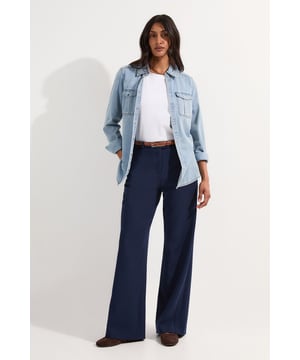 These Karen Millen wide-leg trousers combine sophistication with everyday wearability. The tailored design features a flattering high waist that creates a lengthening effect, while the stretch fabric ensures all-day comfort. Style with a crisp white t-shirt and denim overshirt for casual weekend brunches, or pair with a fitted blouse and loafers for effortless office attire. The versatile wide-leg silhouette can be styled with both flat shoes and heels, making these trousers a true wardrobe staple. For cooler days, layer with an oversized knit jumper and trainers for a relaxed yet put-together look. These trousers transition seamlessly from day to evening, simply switch your accessories to refresh your ensemble for after-work gatherings.   Tailored wide leg design Stretch fabric blend Flattering high-rise waistband with belt loops Sleek side pockets maintain the trousers' streamlined appearance Full-length cut with generous wide leg