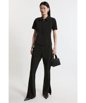 Experience elevated tailoring in a pair of flared trousers, made in comfortable, stretchy fabric, featuring a flattering, figure hugging fit and a comfortable high waistline. The sleek design makes them easy to style with anything, from the matching shirt for a co-ordinating evening look, to a T-shirt and loafers for a more laid back approach. Luxe Ponte Jersey Flared Trousers Comfortable High Waistline Flattering Slim Leg Fit Sleek, Minimal Design Playful Flared Ankles Matching Pieces Sold Separately