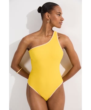 Make a statement poolside with this Karen Millen one shoulder swimsuit that perfectly balances sophistication with modern flair. The asymmetrical neckline and strategic cut-out create a captivating silhouette that draws the eye. The high-cut leg lengthens your silhouette, making this piece ideal for both lounging by the pool and coastal walks. For a complete ensemble, layer with a flowing kaftan and slide sandals when moving from sunbathing to beachside dining. This versatile swimsuit transitions seamlessly from daytime swimming to sunset cocktails with just a few thoughtful accessories.   Asymmetrical one shoulder design Cut-out feature enhances the contemporary silhouette Contoured fit with high-cut leg Stretchy fabric blend Distinctive contrast stitching