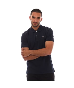 Mens Tommy Jeans Casual Polo Shirt in navy.- Ribbed polo collar.- Short sleeves with ribbed cuffs.- Two button placket.- Tommy Hilfiger flag embroidery on chest.- Split hem.- Regular fit.- 100% Cotton.- Ref.: DM0DM20763C1G