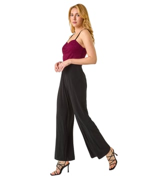 Dusk Sweetheart Lace Stretch Jumpsuit from Roman. Make a statement in our trendy jumpsuit, perfect for your next special event. Featuring a romantic sweetheart neckline with a delicate lace bodice, this full-length jumpsuit combines elegance with comfort. Crafted from stretch jersey fabric, this jumpsuit ensures a flattering fit. Pair with heels and a bolero for a sophisticated and stylish look that will surely turn heads!
