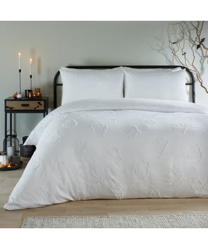 Wrap yourself in the cosy luxury of the Ghostly Ghouls Ultra Soft Touch Duvet Cover Set, where comfort meets a touch of Halloween charm. Designed with a tufted pattern of playful ghost motifs, this bedding creates an inviting and whimsical atmosphere that effortlessly complements any interior. The ultra-soft fabric adds a layer of indulgence, making every night feel like a retreat, while the plain reverse ensures easy versatility to suit your style. Simple to care for and undeniably charming, it’s the perfect way to enhance your room with a seasonal twist that feels as good as it looks.