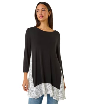 Polka Dot Side Split Tunic Top from Roman. Feel playful this season in our polka dot tunic top. Designed with a flattering round neckline and 3/4 length sleeves, this top is crafted from a stretch jersey fabric for ultimate comfort. Lined with a charming polka dot mesh hem and a stylish side split finishing below hip length, this top is perfect for Spring Summer. Pair with jeggings and trainers for a complete casual look!