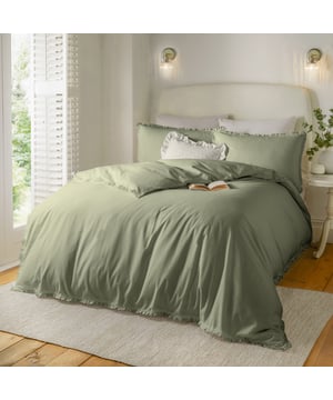 Transform your bedroom into a calm, soothing retreat with the Tilly Ruffle Duvet Cover Set. Crafted from luxuriously soft, breathable tumbled cotton with a 144 thread count, it ensures comfort throughout the seasons while inviting restful sleep. The subtle ruffle trim on the duvet and pillowcases adds a touch of timeless charm, blending effortlessly with both classic and modern interiors. Designed for those who cherish understated elegance, this minimalistic set brings a sense of effortless sophistication to your space, creating a serene sanctuary where style and comfort meet seamlessly.