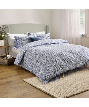 Elevate your bedroom with the Hannah Duvet Cover Set, designed to bring a touch of natural elegance to your space. Crafted from 100% tumbled cotton with a soft 144 thread count, this set promises a breathable, luxurious night's sleep. The timeless floral pattern, printed on both sides, offers effortless versatility while perfectly blending sophistication with countryside-inspired charm. Thoughtful bow-closure details add a delicate, handcrafted aesthetic, while ensuring a secure fit. Whether styled in a sleek modern setting or a relaxed country retreat, this duvet cover invites refined comfort and nature-inspired beauty into your home.