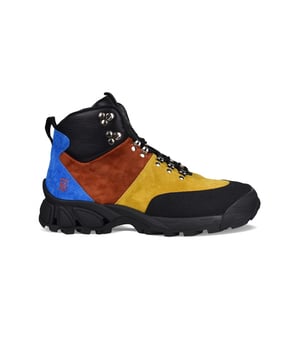Botas Tor multicolores en piel y ante de Burberry.Inserciones en negro, azul, amarillo mostaza y marrón.Logotipo rojo grabado en el lateral visible.Cordones negros.Lengüeta de piel con parche del logotipo.Suela gruesa de goma negra.Made in Italy.