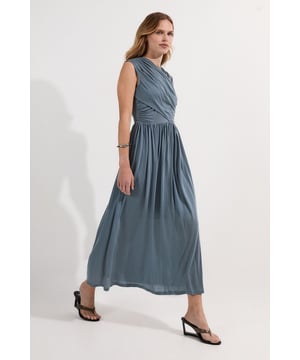 This Karen Millen wrap detail midi dress embodies refined elegance with its draped bodice and flowing silhouette. The thoughtfully designed crossover detail creates visual interest while the gathered waist cinches in to create a flattering feminine shape. Perfect for special occasions, style with metallic strappy heels and statement gold jewellery for a sophisticated wedding guest ensemble. For evening events, add a structured clutch and delicate drop earrings. The versatile midi length works equally well for daytime functions when paired with nude court shoes and a tailored blazer. The luxurious jersey fabric moves gracefully with every step, ensuring you remain comfortable throughout your event while maintaining an effortlessly polished appearance.  Elegant wrap detail across the bodice Sleeveless design with a flattering V-neckline Midi length Gathered waist detail