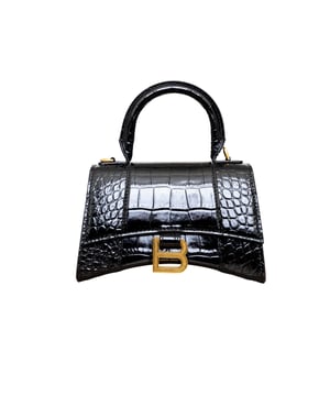 VINTAGE, RRP AS NEW
Crafted from black, shiny crocodile embossed calfskin, this Balenciaga handbag in XS format features the iconic curvilinear base, one top handle, and a studded magnet closure for a chic and modern touch. The aged-gold B logo hardware and nappa lambskin lining add a touch of sophistication, while the back and inner pockets and the removable shoulder strap make the bag more functional.
Inclusion: dust bag, shoulder strap.
NFT option available. Discover more.
Assured Product Authenticity: This product is supplied by a renowned and trusted partner.
With this purchase, you are preserving iconic craftsmanship, celebrating heritage, and embracing the beauty of conscious shopping.Measurments:  width: 165 mm length: 457 mm height: 300 mm handle drop: 165 mm