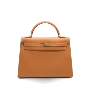 VINTAGE, RRP AS NEW
Introducing the iconic Kelly 32 by Hermes in a glamorous golden tone with gold hardware. Crafted with the highest quality materials and meticulous attention to detail. The bag's neutral colour and gold hardware make it a versatile and luxurious investment. Measurments:  width: 610 mm height: 762 mm