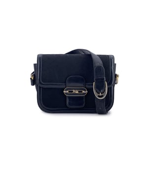 VINTAGE, RRP AS NEW
Elegant and quietly iconic, this vintage C Carriage box shoulder bag from Celine captures the understated luxury of a bygone era. Crafted in the classic black Macadam C canvas and framed with black leather trim, it exudes the timeless sophistication that made Celine a favorite of the Parisian elite.  The structured flap is secured with the signature gold-tone Caleche Carriage clasp-a refined emblem of the house's heritage-while an adjustable leather shoulder strap ensures effortless versatility, whether worn high or slung low. Inside, the black leather lining reveals a thoughtfully designed interior: three main sections, a side zip pocket, and two open pockets to keep everything gracefully in place.  Stamped discreetly with "Celine Paris - Made in Italy" inside, this C Carriage bag is more than a collector's piece-it's a polished companion for the modern vintage lover, carrying the quiet charm of Céline's past into your present. Condition Rating: B - VERY GOOD CONDITIONCondition Details: Gently used. Some light scratches on leather parts. Some scratches on the internal lining. Please check the photos carefully and ask if you need to know more details or if you have any doubts.Measurements (cm):Depth: 7.6Height: 17.8Length: 22.9Other Details: Dustbag? NoKeys? NoBox? No Measurments:  width: 76 mm length: 229 mm height: 178 mm