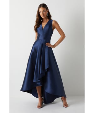 Elegant plunge neckline for a sophisticated look
        Sleeveless design perfect for warm-weather weddings
        Dramatic waterfall skirt with high-low hemline
        Fitted bodice accentuates the waistline
        Floor-sweeping maxi length for a graceful silhouette
    
    This stunning bridesmaids maxi dress from Coast is the epitome of elegance and grace. The plunging V-neckline adds a touch of allure, while the fitted bodice creates a flattering silhouette. The pice de rsistance is undoubtedly the waterfall skirt, which cascades beautifully to the floor, creating a mesmerising high-low effect. Perfect for a sophisticated bridal party, this dress will ensure you look and feel your best as you support the bride on her special day. Style with delicate strappy sandals and a sleek updo to complement the dress's clean lines. For a coordinated bridal party look, consider matching accessories such as pearl earrings or a dainty bracelet. This versatile piece will have you feeling confident and radiant as you celebrate love and new beginnings.