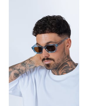 Frame Colour: Clear Blue
Lense Colour: Brown
Material: PC Lens PC Frame
One Size
SKU: SG2502120
UV 400 PROTECTION 
LENS FILTER CATEGORY 3