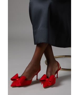 Elegant satin court shoes with a striking bow detail
        Slingback design for a secure and comfortable fit
        Medium stiletto heel measuring between 5 and 6.5cm
        Pointed toe silhouette for a sophisticated look
        Versatile style suitable for various formal occasions
    
    Step into elegance with these exquisite Lola satin court shoes from Coast. The eye-catching bow detail adorning the pointed toe adds a touch of feminine charm, while the slingback design ensures a secure fit as you glide across the dance floor. With a medium stiletto heel that strikes the perfect balance between comfort and style, these shoes are ideal for weddings, race days, or any sophisticated soire. Pair them with a flowing midi dress for a timeless ensemble, or contrast their delicate appearance with a sharply tailored suit for a modern twist. The versatility of these shoes makes them a wardrobe staple for the discerning woman who appreciates quality and style in equal measure.