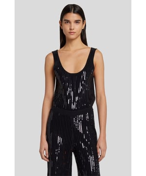 Damen  In unserem neuen Sequin Knit Jumpsuit strahlen Sie mühelosen Abendglamour aus. Dieser schwarze Jumpsuit mit weitem Bein und U-Ausschnitt ist großzügig mit glitzernden Pailletten besetzt. Für Ihre nächste Partynacht empfehlen wir dazu einen Taillengürtel und schwindelerregend hohe Stiefel.