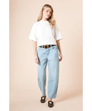 Distinctive barrel leg silhouette for a contemporary shape
        High-rise waistband for a flattering fit
        Classic five-pocket design with traditional stitching
        Relaxed through the thigh with a tapered ankle
        100% cotton fabric for breathable comfort
    
    These Dorothy Perkins Barrel Leg Jeans offer the perfect balance of comfort and style for your casual wardrobe. The relaxed barrel silhouette creates a modern look whilst maintaining a flattering shape that works beautifully for daytime occasions. Style as seen with a simple white tee and leather loafers for a chic brunch ensemble, or pair with a soft knit jumper and trainers for family gatherings. The versatile design makes these jeans ideal for weekend shopping trips or casual coffee dates. The high-rise waist can be accentuated with a statement belt, as shown, to define your silhouette. These jeans are machine washable, making them a practical addition to your everyday rotation - perfect for the woman who values both style and functionality in her wardrobe.