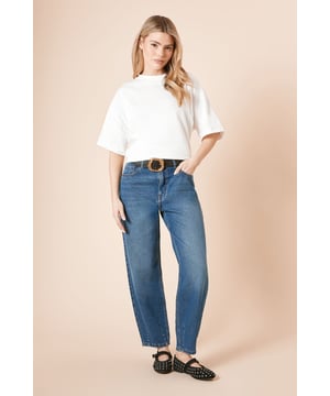 Distinctive barrel leg silhouette for a contemporary shape
        High-rise waistband for a flattering fit
        Classic five-pocket design with traditional stitching
        Relaxed through the thigh with a tapered ankle
        100% cotton fabric for breathable comfort
    
    These Dorothy Perkins Barrel Leg Jeans offer the perfect balance of comfort and style for your casual wardrobe. The relaxed barrel silhouette creates a modern look whilst maintaining a flattering shape that works beautifully for daytime occasions. Style as seen with a simple white tee and leather loafers for a chic brunch ensemble, or pair with a soft knit jumper and trainers for family gatherings. The versatile design makes these jeans ideal for weekend shopping trips or casual coffee dates. The high-rise waist can be accentuated with a statement belt, as shown, to define your silhouette. These jeans are machine washable, making them a practical addition to your everyday rotation - perfect for the woman who values both style and functionality in her wardrobe.