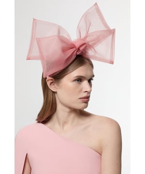 Make a striking impression with this Karen Millen Bow Headband, the perfect finishing touch for your evening ensemble. The generously proportioned bow commands attention whilst the semi-transparent mesh fabric adds a touch of sophistication and visual intrigue. This versatile accessory pairs with asymmetric necklines as shown, or with classic cocktail dresses for formal gatherings. Ideal for elevating your going-out wardrobe, this statement piece transforms even the simplest outfit into something extraordinary. Whether you're heading to an upscale cocktail bar or dancing the night away at a club, this bow headband offers that perfect balance of playfulness and elegance that Karen Millen is renowned for.  Dramatic oversized bow design for a bold statement accessory Sheer mesh fabric Comfortable headband base for secure all-night wear Structured yet soft construction maintains the bow's impressive shape