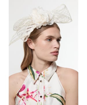 Make a statement at your next evening soire with this eye-catching Karen Millen mesh floral bow headband. The dramatic bow silhouette frames the face beautifully, while the intricately crafted flower centrepiece adds a touch of romantic charm. Perfect for elevating your going-out ensemble, this headband pairs wonderfully with sleek hairstyles and floral printed dresses. For maximum impact, style with minimal jewellery and a monochrome outfit to let this statement piece truly shine. A sophisticated alternative to traditional evening accessories, this headband will become your go-to for adding instant glamour to any nightlife look.  Striking mesh bow design Handcrafted floral centrepiece with petal detailing Comfortable headband structure ensures secure fit throughout wear Lightweight mesh material