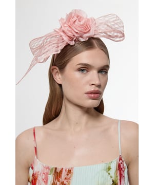 Make a statement at your next evening soire with this eye-catching Karen Millen mesh floral bow headband. The dramatic bow silhouette frames the face beautifully, while the intricately crafted flower centrepiece adds a touch of romantic charm. Perfect for elevating your going-out ensemble, this headband pairs wonderfully with sleek hairstyles and floral printed dresses. For maximum impact, style with minimal jewellery and a monochrome outfit to let this statement piece truly shine. A sophisticated alternative to traditional evening accessories, this headband will become your go-to for adding instant glamour to any nightlife look.  Striking mesh bow design Handcrafted floral centrepiece with petal detailing Comfortable headband structure ensures secure fit throughout wear Lightweight mesh material