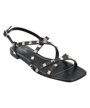 - Rockstud jelly sandals from Valentino Garavani featuring an ankle strap with a side buckle, a branded insole, a T-bar strap, an open toe, and gold-tone studs
- PVC 100%
- Made in: Italy