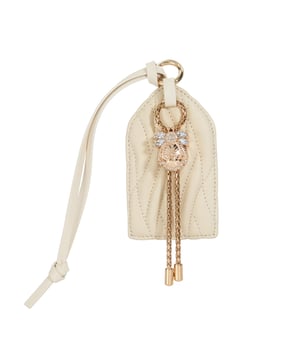 Personalise your luggage and make it uniquely yours with this signature Dune bug charm.