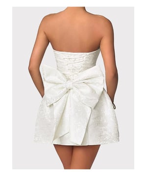Lace
  Up Sleeveless Satin Mini Dress with Bow
  Features: Bow Lace
  Up
  Sheer: Opaque
  Stretch: No stretch
  Body: Not lined
  Material composition: 100% polyester
  Care instructions: Machine wash cold tumble dry low
  Imported
  Product Measurements (Measurements by inches) & Size Conversion
  Size: US
  S: Length 25 Bust 30.7 Waist 27.2
  M: Length 25.4 Bust 32.3 Waist 28.7
  L: Length 26 Bust 34.6 Waist 31.1
  XL: Length 26.6 Bust 37 Waist 33.5