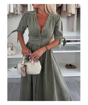 Button Front V
  Neck Half Sleeve Denim Dress
  65% cotton 35% polyester
  Buttoned front
  Tied waist
  No stretch
  Machine wash cold tumble dry low
  Imported
  Length: 49.6 inches (Small) 50 inches (Medium) 50.4 inches (Large) 50.8 inches (X
  Large)
  Shoulder: 14.6 inches (Small) 15 inches (Medium) 15.4 inches (Large) 15.7 inches (X
  Large)
  Bust: 33.9 inches (Small) 35.4 inches (Medium) 37.8 inches (Large) 40.2 inches (X
  Large)
  Sleeve Length: 12.2 inches (Small) 12.6 inches (Medium) 13 inches (Large) 13.4 inches (X
  Large)
  Waist: 27.6 inches (Small) 29.1 inches (Medium) 31.5 inches (Large) 33.9 inches (X
  Large)
Material: Denim