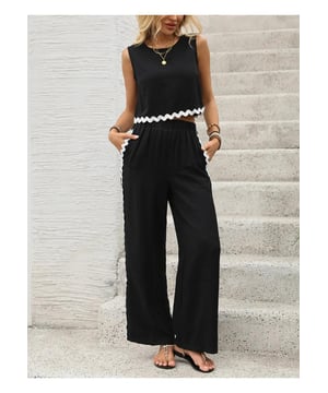 Mouwloze top met ronde hals
  Top met knopen en zak
  Tweedelige set
  Materiaalsamenstelling: 88% viscose 12% polyamide
  Machinewas koud droogtrommel laag
  Geimporteerd