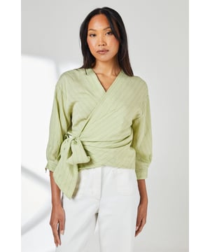 Elegant wrap design with side tie detail for a flattering silhouette
        Textured striped pattern adds visual interest to this versatile top
        Three-quarter length sleeves offer comfortable coverage
        V-neckline creates a feminine frame for necklaces or scarves
        Linen blend fabric provides breathable comfort for all-day wear
    
    This Principles wrap top combines effortless style with everyday comfort. The distinctive side-tie detail creates a figure-enhancing shape that works beautifully with both structured and relaxed bottoms. As shown, pair with crisp white trousers and flat sandals for a polished daytime look, perfect for weekend brunches or casual gatherings. The textured striped fabric adds subtle dimension whilst the three-quarter length sleeves make this piece ideal for transitional weather. For cooler days, layer under a lightweight cardigan or denim jacket. Complete your ensemble with a woven handbag and simple jewellery for an understated yet sophisticated daywear option that transitions seamlessly from coffee dates to family lunches.