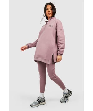 Maternity-friendly oversized sweat top with half-zip design
        Comfortable rib leggings for growing bump
        Coordinated set for effortless style
        Practical front pocket on sweat top
        Versatile for various casual occasions
    
    Embrace comfort and style during your pregnancy with this chic maternity tracksuit set from Boohoo. The oversized sweat top features a trendy half-zip design, perfect for adjustable ventilation and easy nursing access. Paired with ribbed leggings that accommodate your growing bump, this set offers both flexibility and fashion-forward appeal. Style the top with the zip partially undone, revealing a contrasting layer underneath for added interest. For a laid-back weekend look, team with chunky trainers and a crossbody bag. Alternatively, dress it up for a casual lunch date by adding statement earrings and swapping trainers for stylish slip-on mules. This versatile set is ideal for family gatherings, relaxed outings with friends, or simply lounging at home in comfort and style.