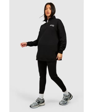 Maternity-friendly oversized sweat top with half-zip design
        Comfortable rib leggings for growing bump
        Coordinated set for effortless style
        Practical front pocket on sweat top
        Versatile for various casual occasions
    
    Embrace comfort and style during your pregnancy with this chic maternity tracksuit set from Boohoo. The oversized sweat top features a trendy half-zip design, perfect for adjustable ventilation and easy nursing access. Paired with ribbed leggings that accommodate your growing bump, this set offers both flexibility and fashion-forward appeal. Style the top with the zip partially undone, revealing a contrasting layer underneath for added interest. For a laid-back weekend look, team with chunky trainers and a crossbody bag. Alternatively, dress it up for a casual lunch date by adding statement earrings and swapping trainers for stylish slip-on mules. This versatile set is ideal for family gatherings, relaxed outings with friends, or simply lounging at home in comfort and style.