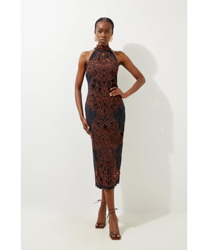 Experienced elevated occasion dressing in our midi dress, made in cotton fabric, featuring a fit that hugs the curves, as well as a cut out back and sheer cutout detailing. Style it with strappy heels for an occasion look that is guaranteed to turn heads wherever you step. Cotton Cutwork Woven Halter Midi Dress High Quality Cotton Fabric Intricately Detailed Floral Pattern Formal, High Neckline Unique Cut Out Accents Figure Hugging Silhouette Statement Keyhole Back Button and Zip Fastenings in Back